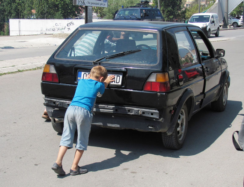 A car being pushed on the main bridge of Mitrovica, Kosovo.